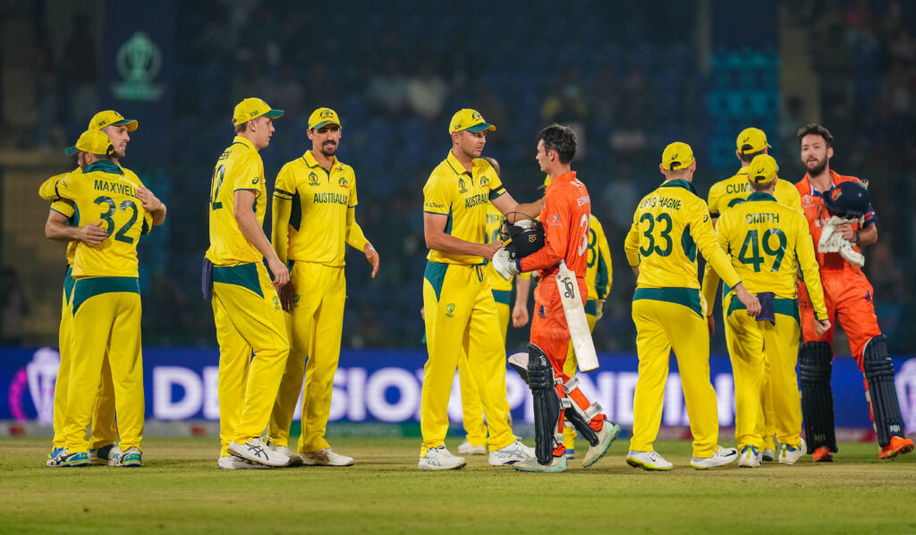 Players of Australia and Netherlands greet each other at the end of their ICC Men's Cricket World Cup 2023 match, at the Arun Jaitley Stadium