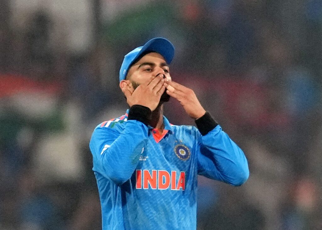 Virat Kohli celebrates the wicket of England's Adil Rashid by India's Mohammed Shami during the ICC Men's Cricket World Cup 2023 match between India and England