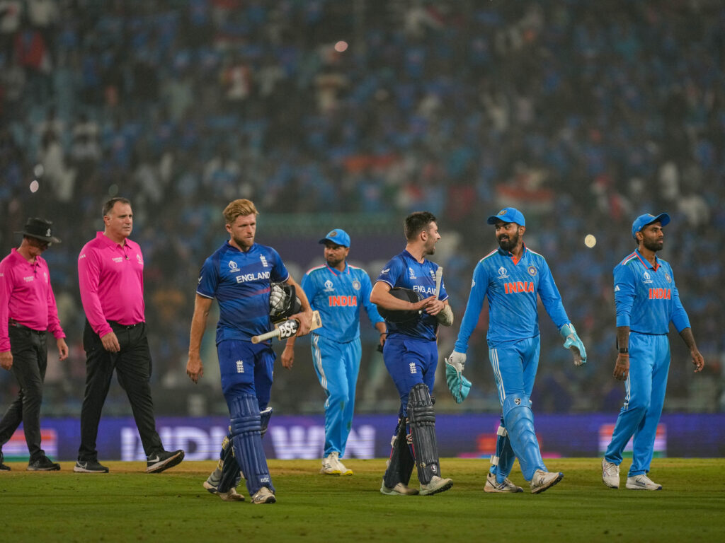 Indian and England players walk off the ground after India won the ICC Men's Cricket World Cup 2023 match against England