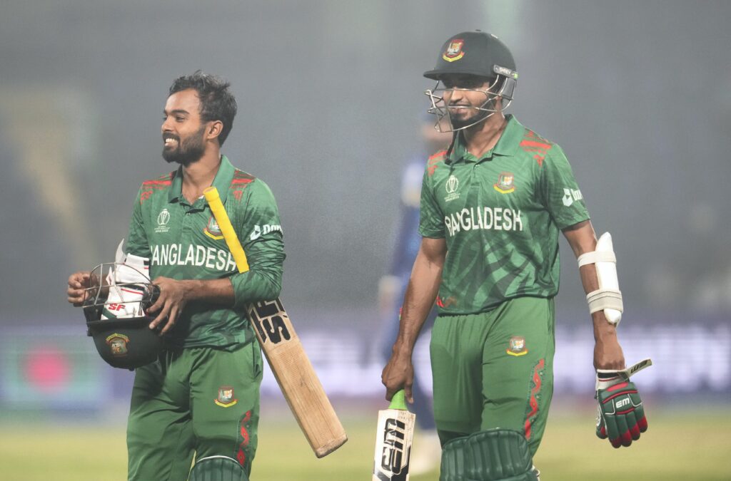 Towhid Hridoy and Tanzim Hasan Sakib compliment each other after winning the ICC Men's Cricket World Cup match against Sri Lanka, in New Delhi.