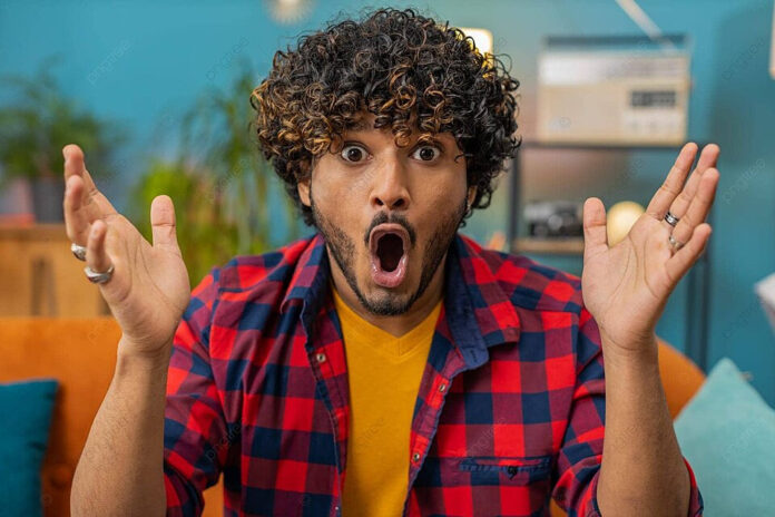 pngtree-indian-man-ecstatic-and-overwhelmed-by-surprise-victory-rejoicing-with-a-wow-reaction-to-good-news-photo-image_51848474